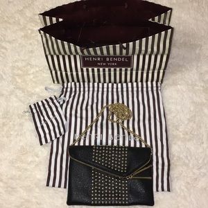 Studded black and gold leather purse